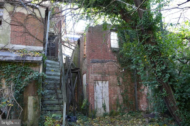 a brick building with a trees in front of it