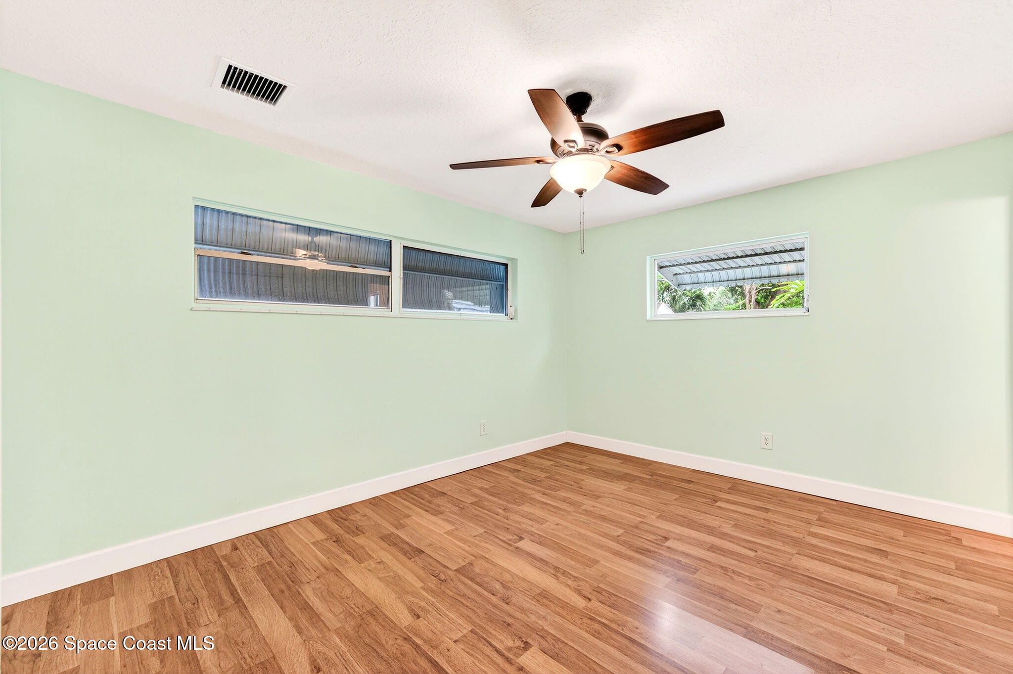 2737 Cherbourg Road Cocoa, FL 32926 - Photo 21 of 44 Primary Bedroom