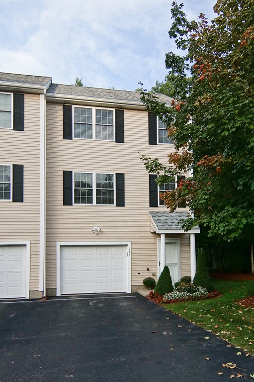 81 Salem Road, Unit 101 Billerica, MA 01821 - Photo 1 of 30 a front view of a house with yard