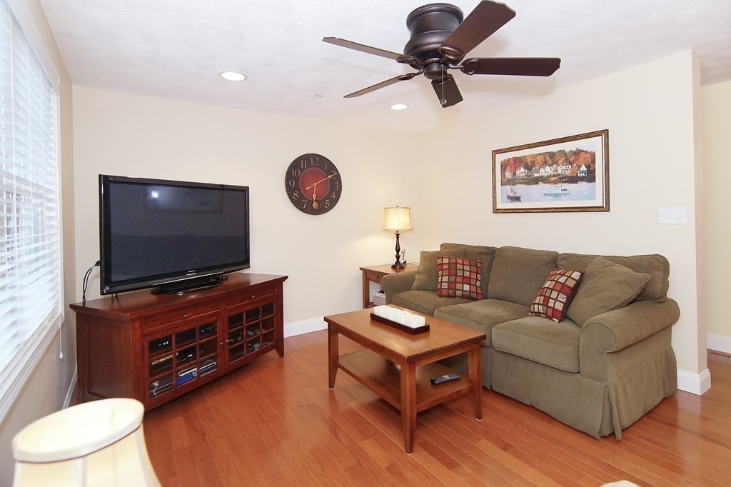 81 Salem Road, Unit 101 Billerica, MA 01821 - Photo 14 of 30 a living room with furniture and a flat screen tv