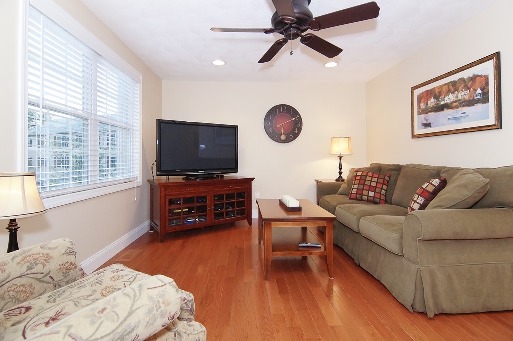 81 Salem Road, Unit 101 Billerica, MA 01821 - Photo 15 of 30 a living room with furniture and a flat screen tv