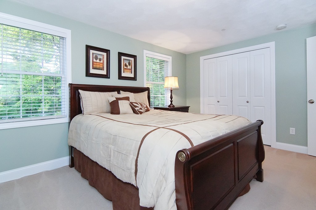 81 Salem Road, Unit 101 Billerica, MA 01821 - Photo 23 of 30 a bedroom with a bed and window