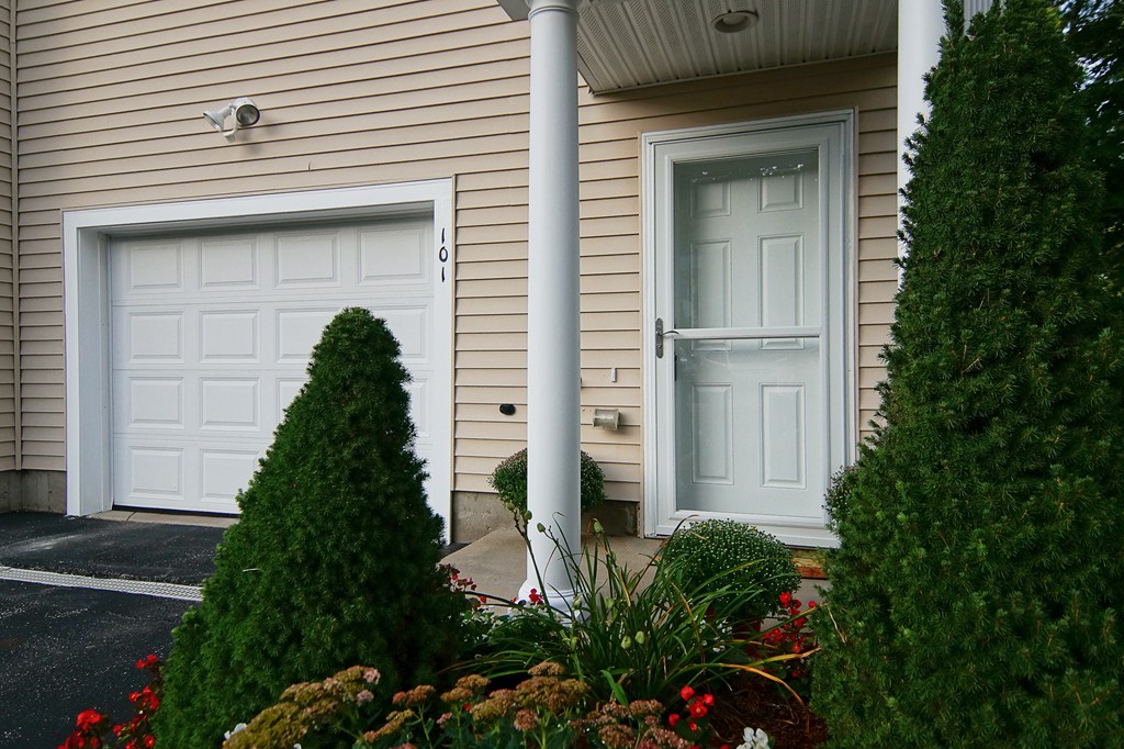 81 Salem Road, Unit 101 Billerica, MA 01821 - Photo 3 of 30 a house view with a outdoor space