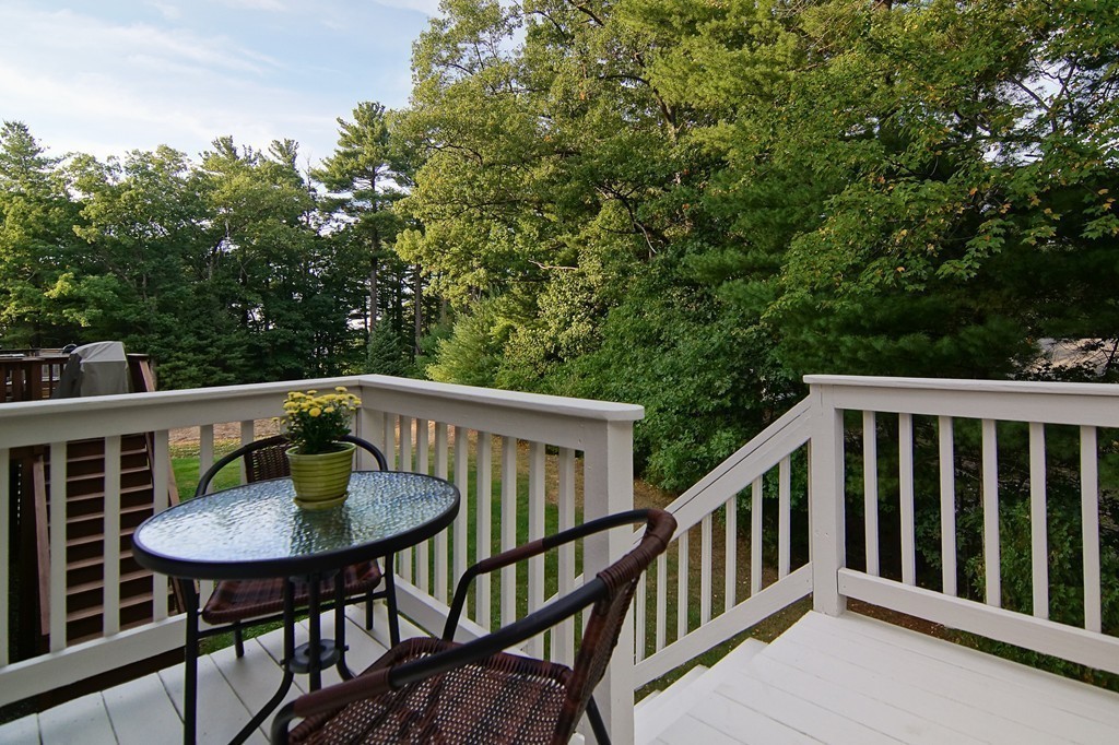 81 Salem Road, Unit 101 Billerica, MA 01821 - Photo 7 of 30 a view of a chair and table in the balcony