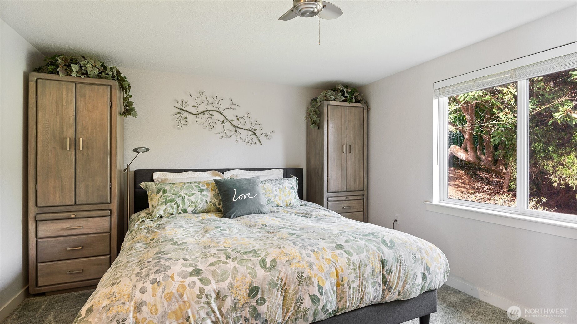 1406 Potlatch Beach Road Marysville, WA 98271 - Photo 12 of 40 a bedroom with a large bed and a window