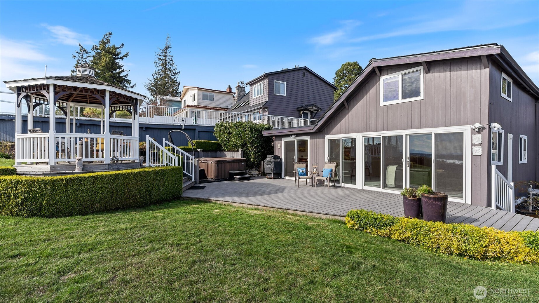 1406 Potlatch Beach Road Marysville, WA 98271 - Photo 30 of 40 a front view of a house with a garden