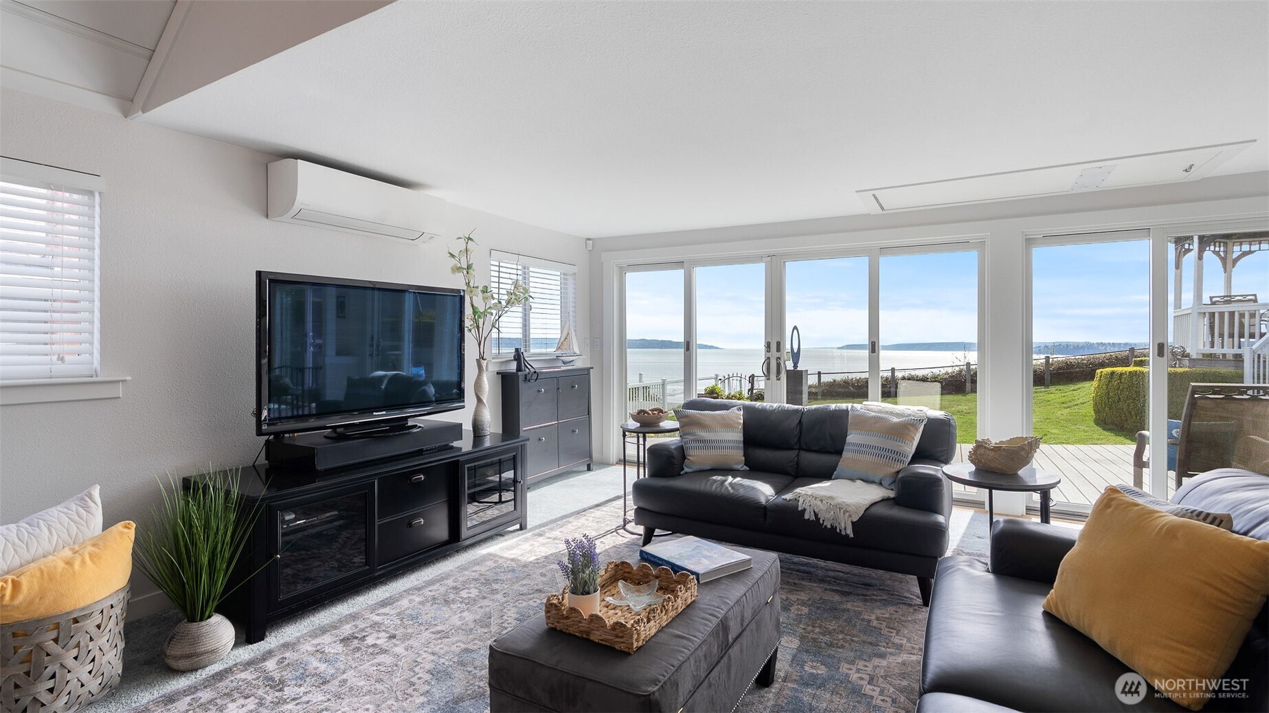 1406 Potlatch Beach Road Marysville, WA 98271 - Photo 4 of 40 a living room with furniture and a flat screen tv