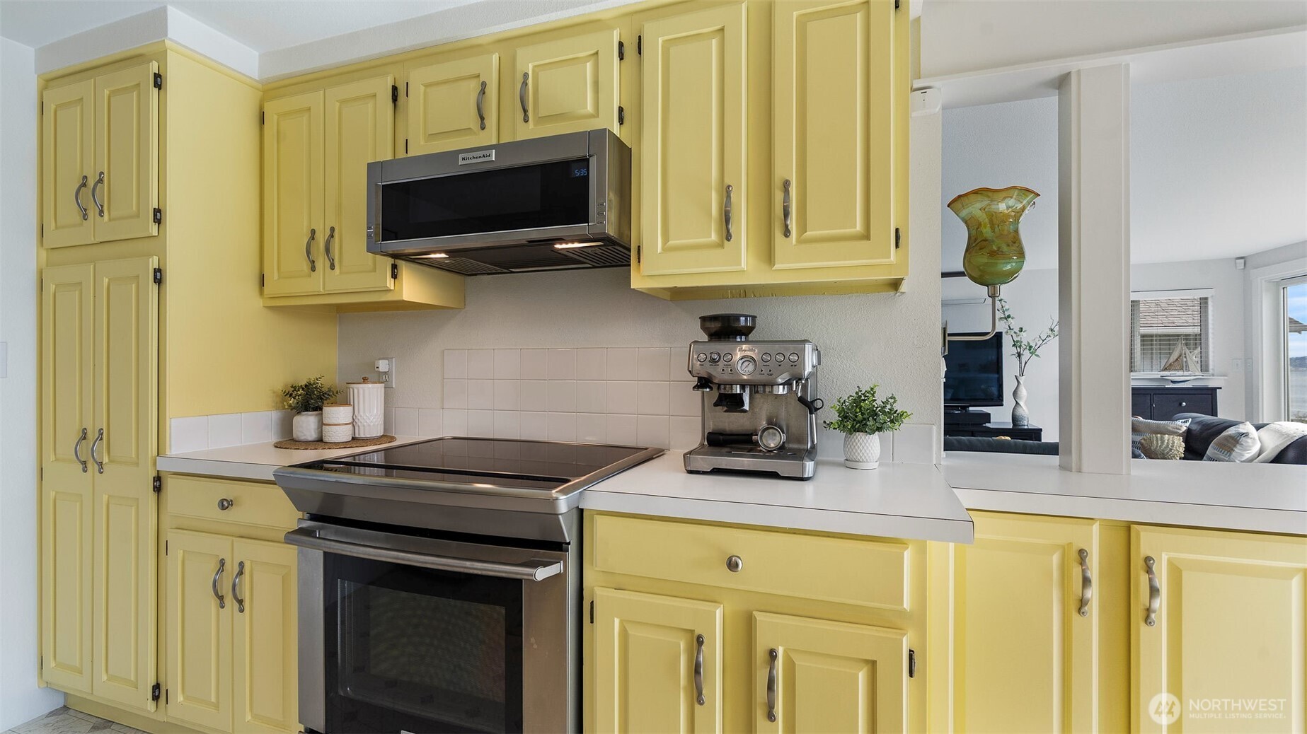 1406 Potlatch Beach Road Marysville, WA 98271 - Photo 8 of 40 a kitchen with stainless steel appliances granite countertop a stove a sink and a microwave