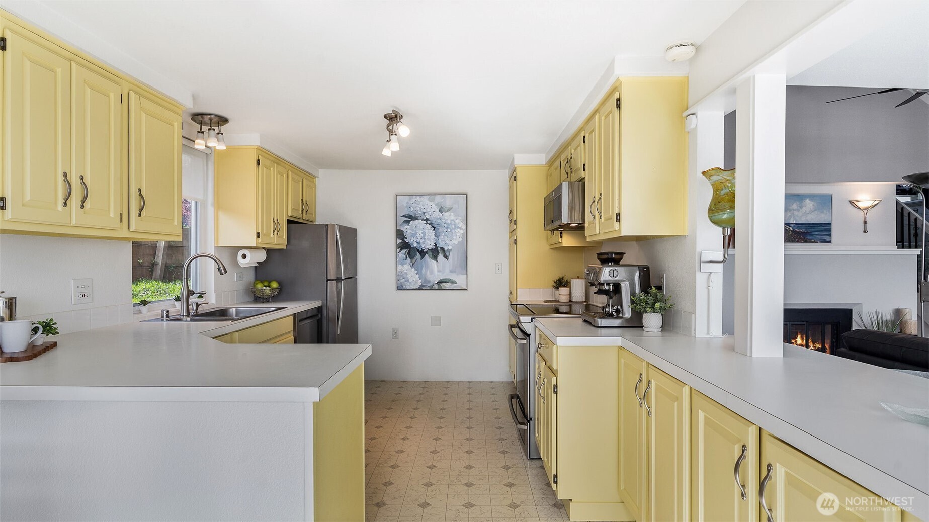 1406 Potlatch Beach Road Marysville, WA 98271 - Photo 9 of 40 a kitchen with a sink a stove and a refrigerator