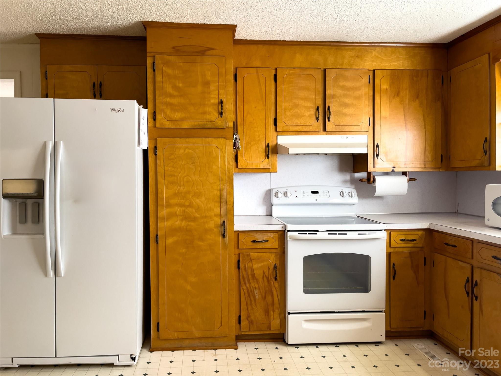 406 Fair Street Bethune, SC 29009 - Photo 13 of 28 a kitchen with a white stove sink and washer