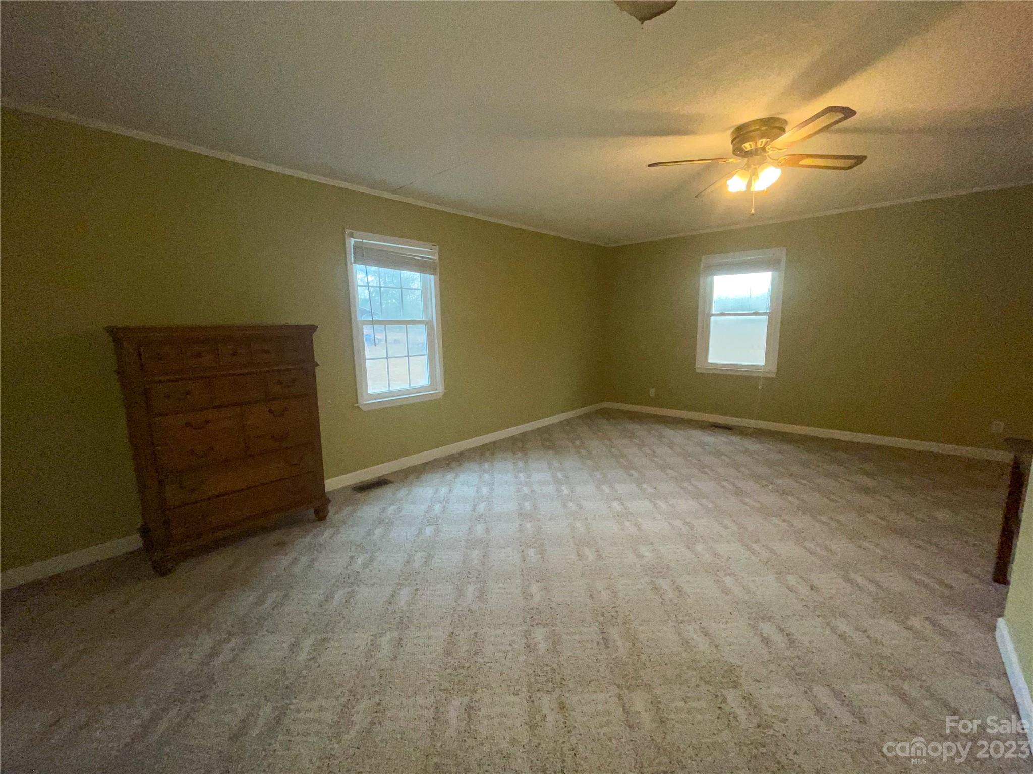 406 Fair Street Bethune, SC 29009 - Photo 16 of 28 an empty room with windows and closet