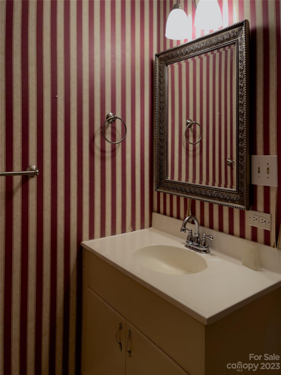406 Fair Street Bethune, SC 29009 - Photo 21 of 28 a bathroom with a sink and a mirror