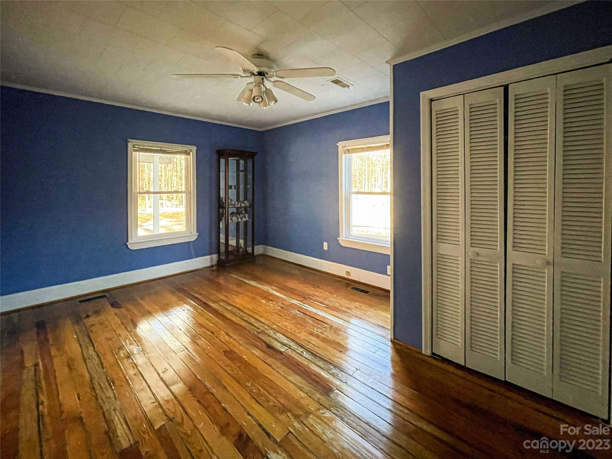 406 Fair Street Bethune, SC 29009 - Photo 23 of 28 a view of an empty room with window and wooden floor