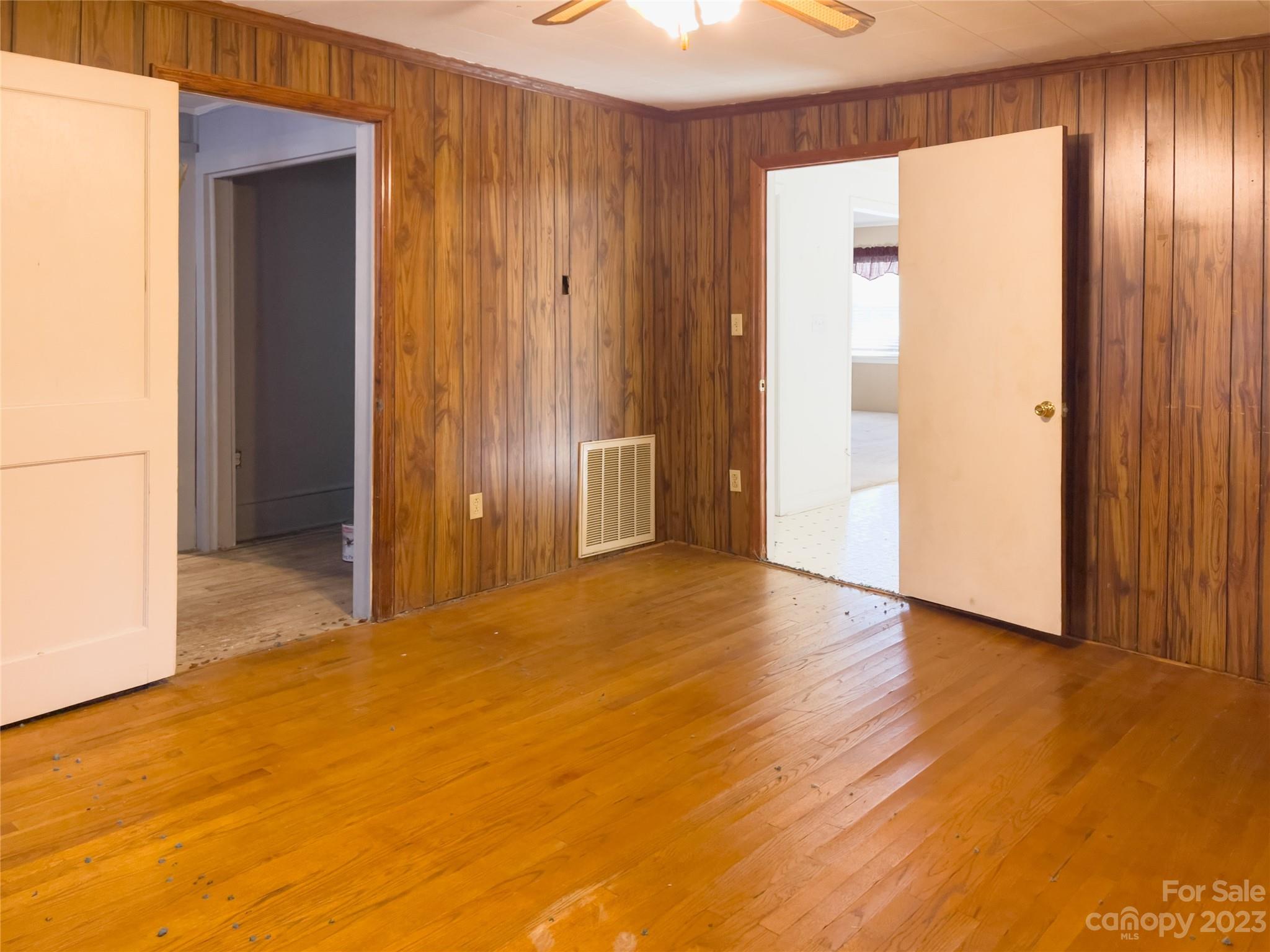 406 Fair Street Bethune, SC 29009 - Photo 25 of 28 a view of an empty room with wooden floor and closet