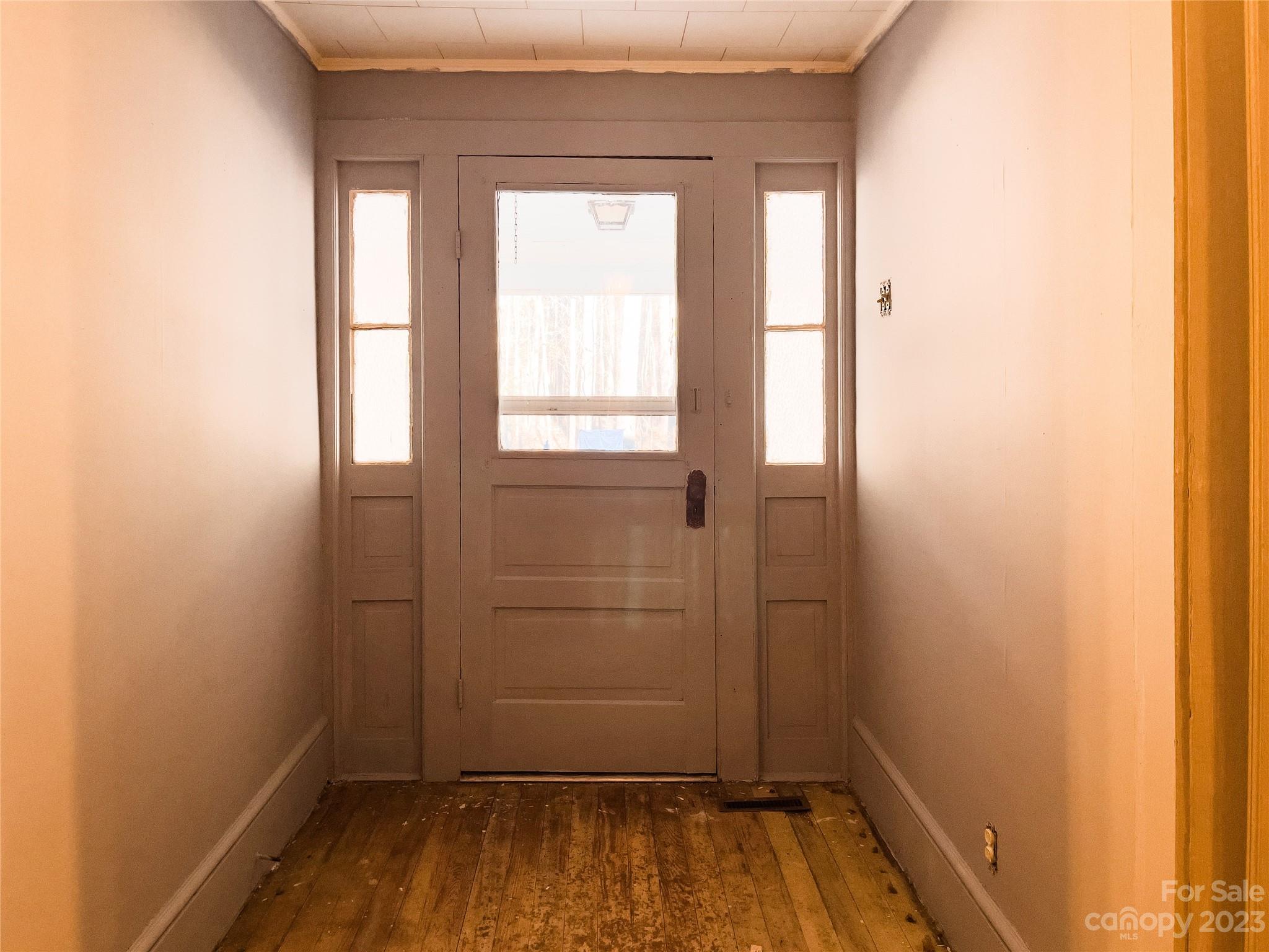 406 Fair Street Bethune, SC 29009 - Photo 28 of 28 an empty room with walk in closet and wooden floor