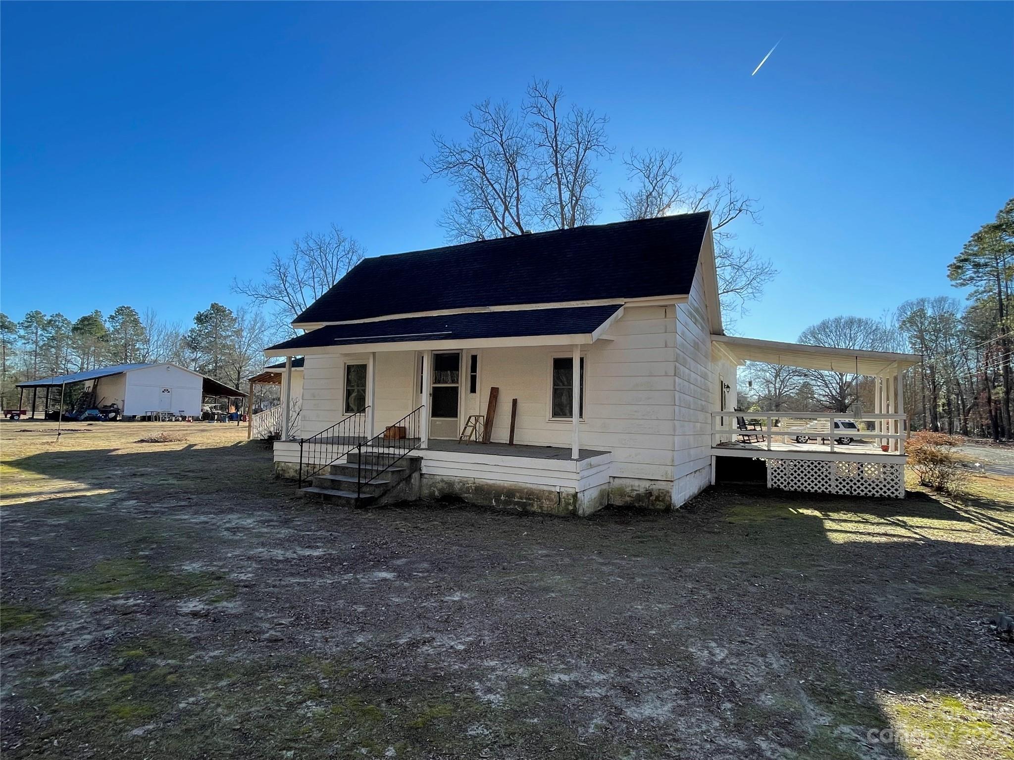 406 Fair Street Bethune, SC 29009 - Photo 3 of 28 a view of a house with a yard