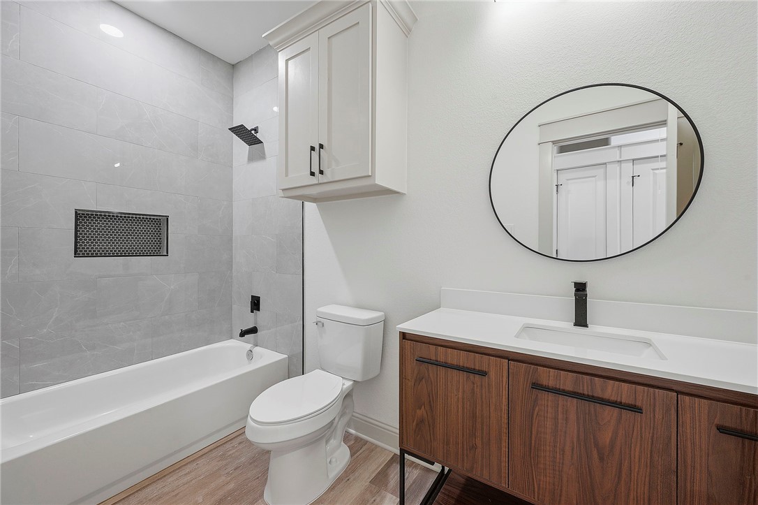 505 Legion Court Bryan, TX 77803 - Photo 13 of 21 a bathroom with a sink toilet and a mirror