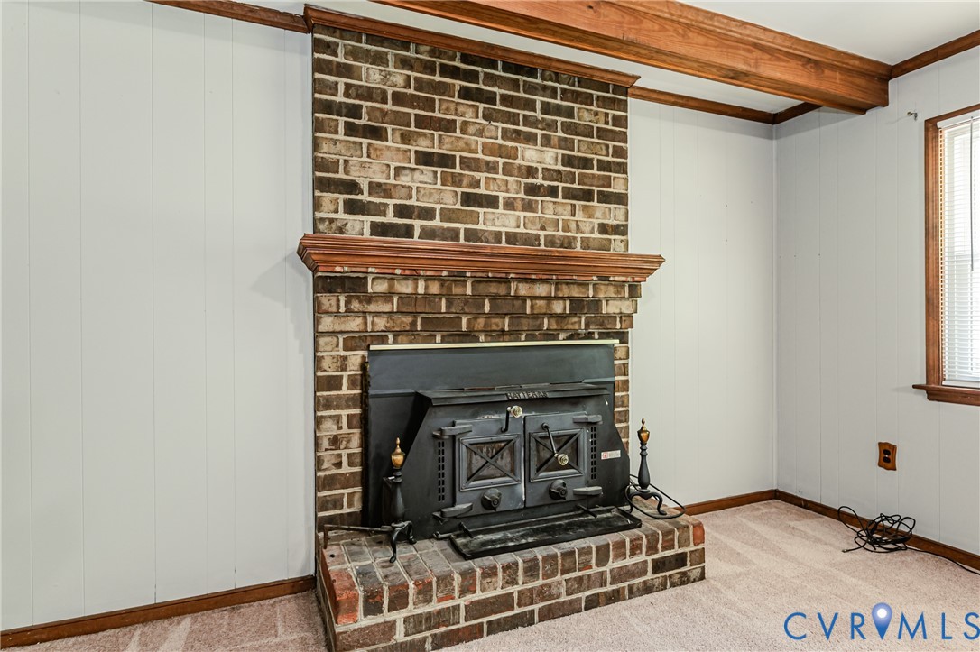 709 Deter Road Richmond, VA 23225 - Photo 14 of 38 Brick fireplace with a wood-burning insert and a c