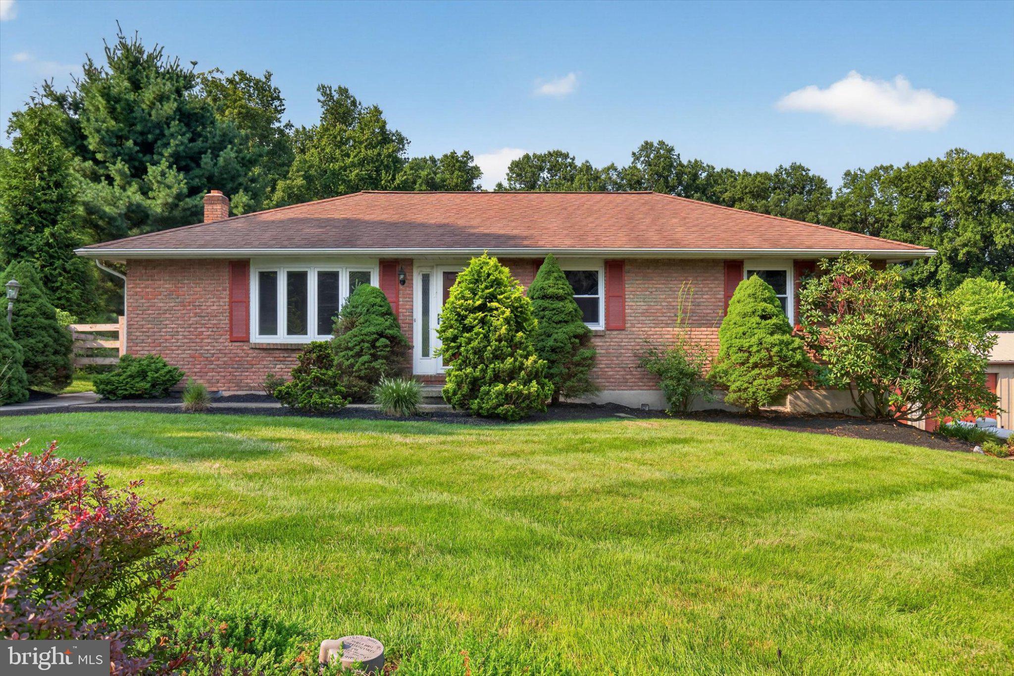 239 Lawn Road Palmyra, PA 17078 - Photo 1 of 64 Charming brick home with lush greenery.