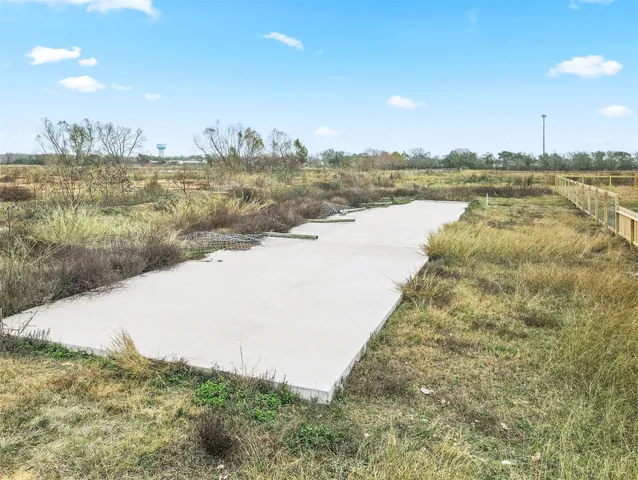 a view of a lake with a yard