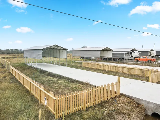 a view of a swimming pool with an outdoor seating