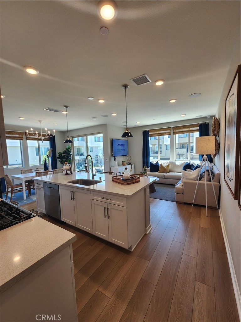 1553 Lima Way, Unit 5 Placentia, CA 92870 - Photo 13 of 22 a kitchen with counter top space a sink appliances and cabinets