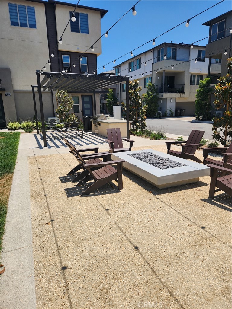 1553 Lima Way, Unit 5 Placentia, CA 92870 - Photo 9 of 22 a building outdoor space with patio furniture and potted plants