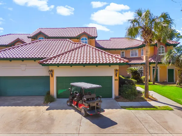 a front view of a house with a garage