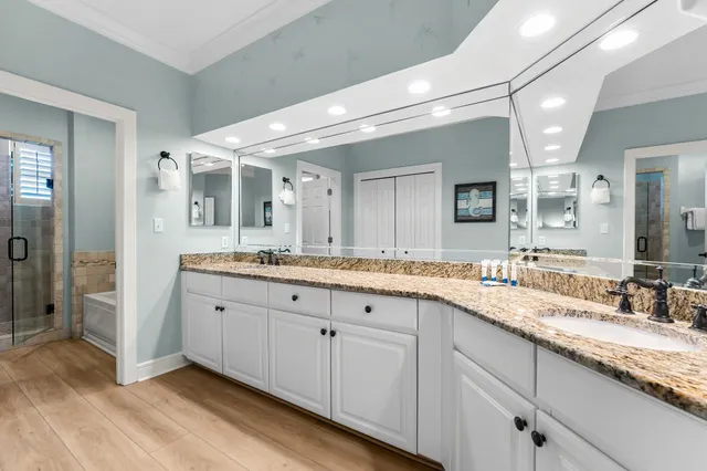 a spacious bathroom with a granite countertop sink mirror and double