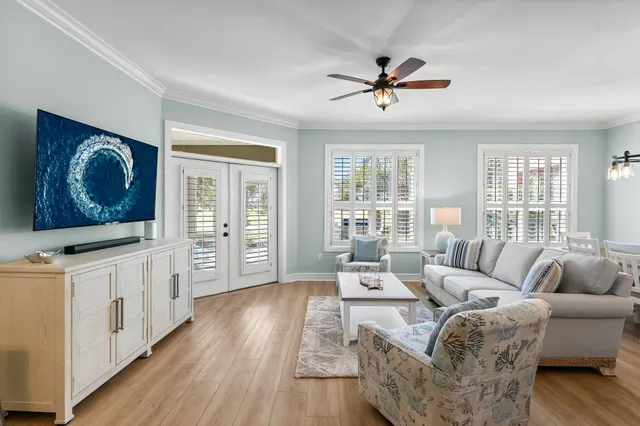 a living room with furniture and a flat screen tv