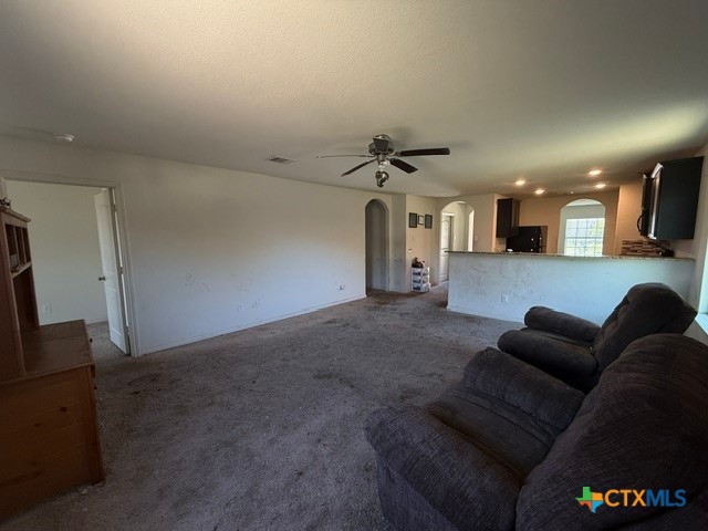 124 Niven Path Jarrell, TX 76537 - Photo 6 of 13 a living room with furniture and a chandelier
