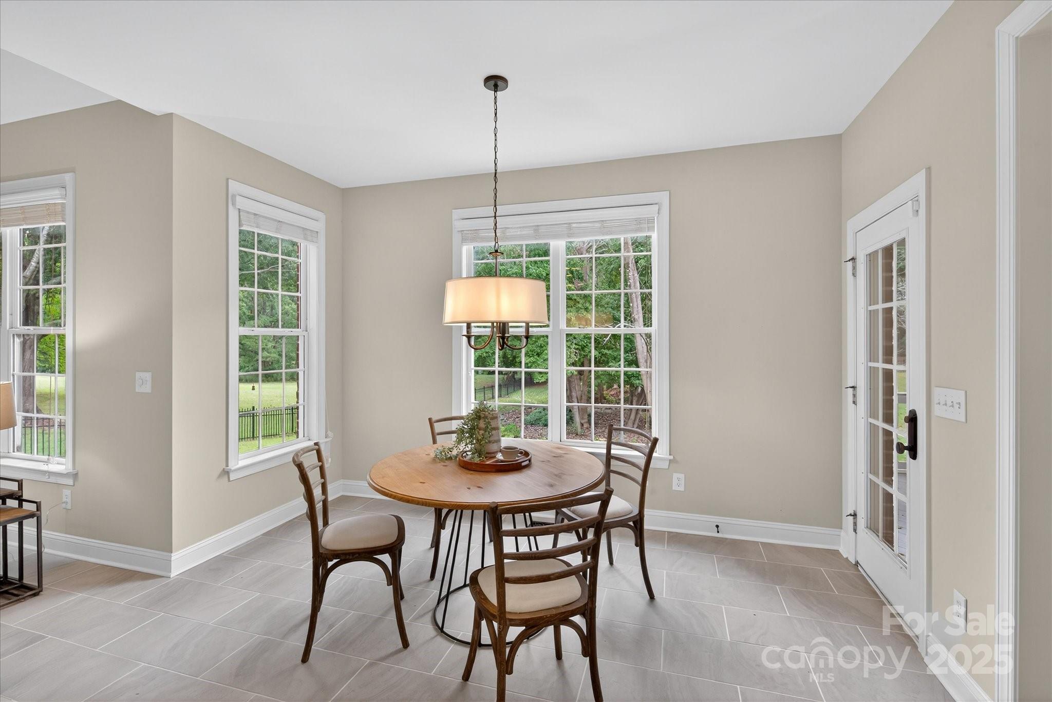 1912 Windmere Drive Monroe, NC 28110 - Photo 12 of 37 a dining room with furniture window and outside view