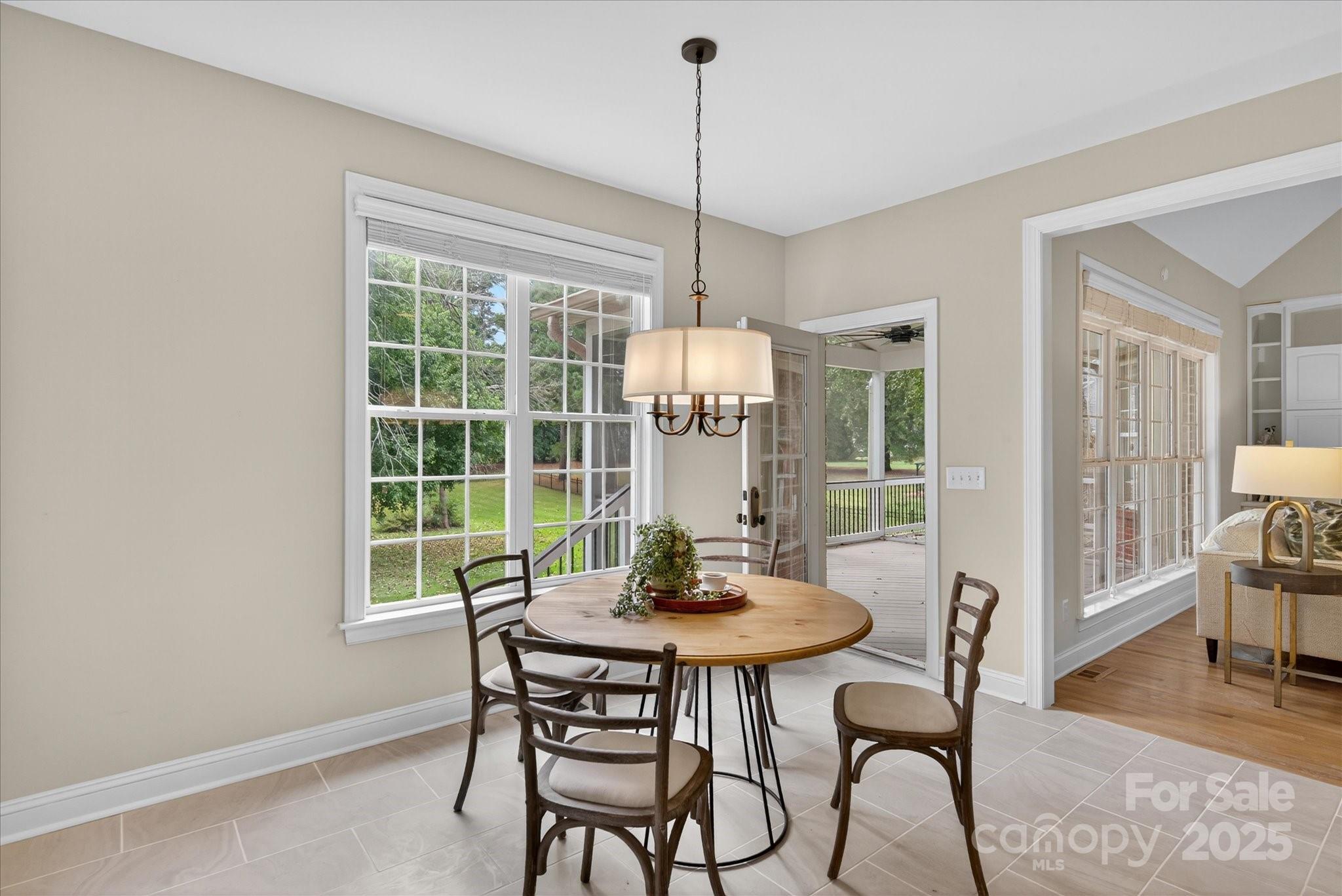 1912 Windmere Drive Monroe, NC 28110 - Photo 13 of 37 a view of a dining room with furniture window and wooden floor