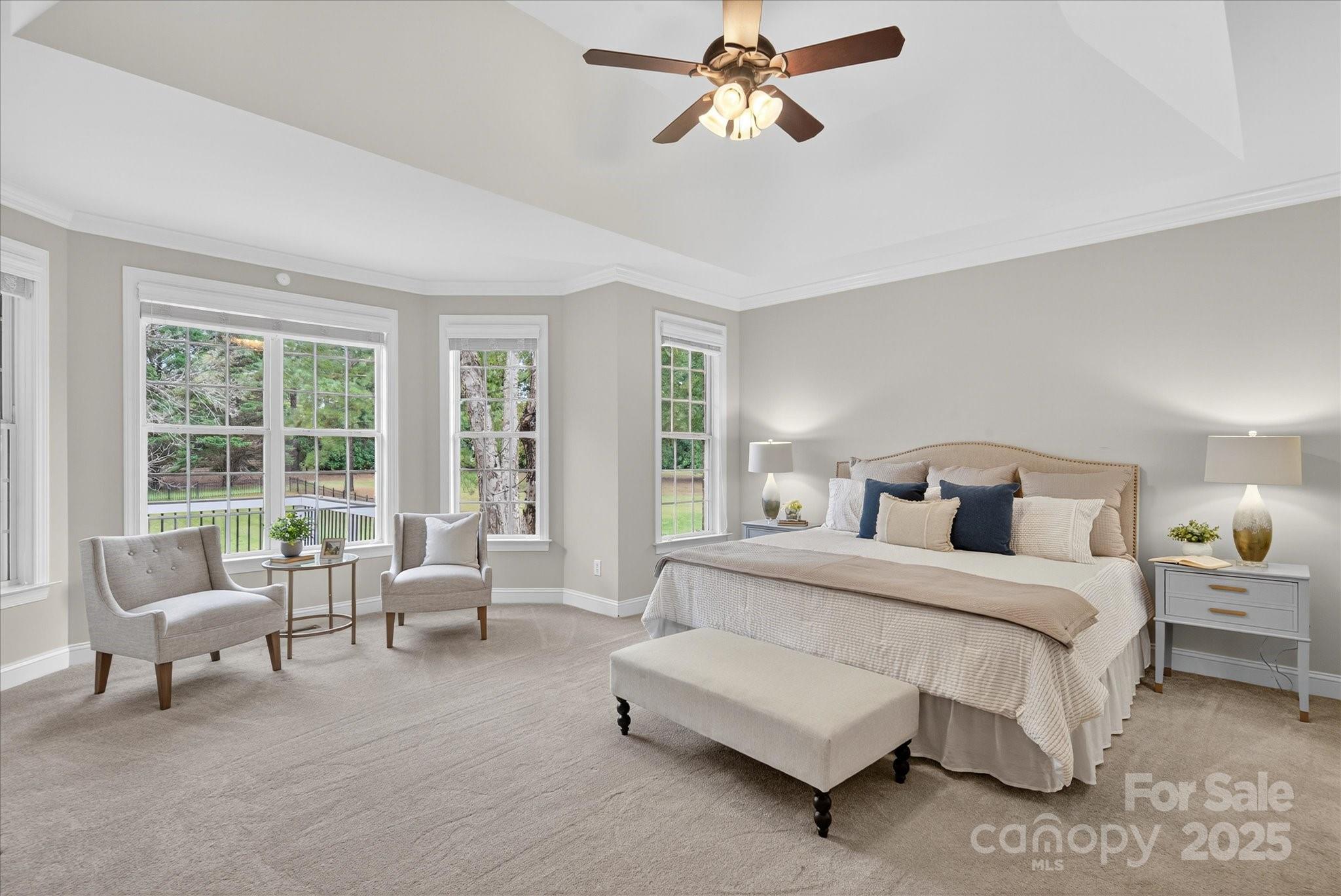 1912 Windmere Drive Monroe, NC 28110 - Photo 17 of 37 a spacious bedroom with a bed and a couch