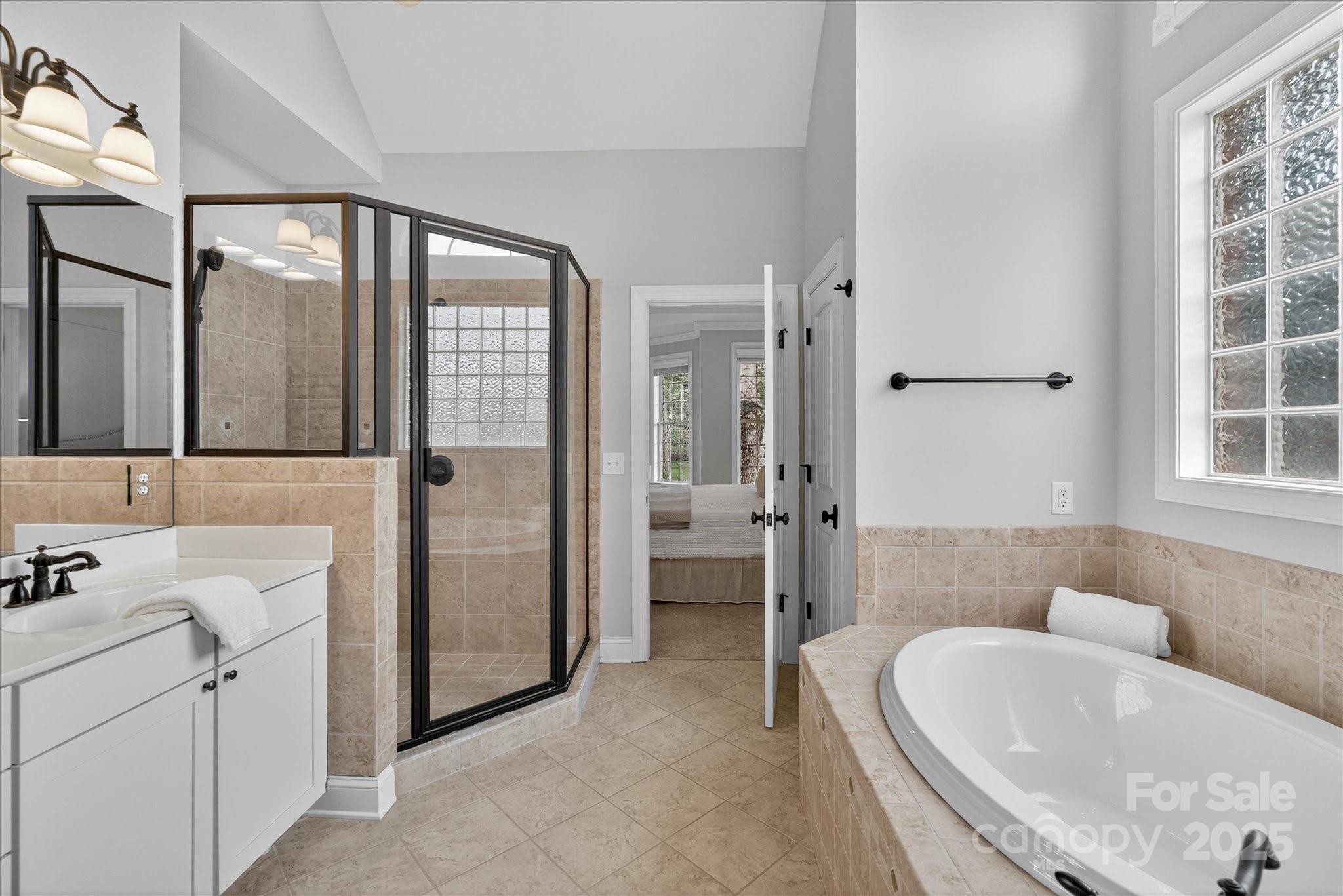 1912 Windmere Drive Monroe, NC 28110 - Photo 20 of 37 a bathroom with a tub sink and mirror