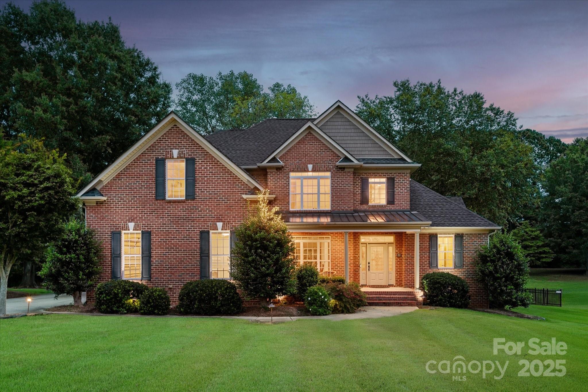 1912 Windmere Drive Monroe, NC 28110 - Photo 2 of 37 a front view of a house with a yard