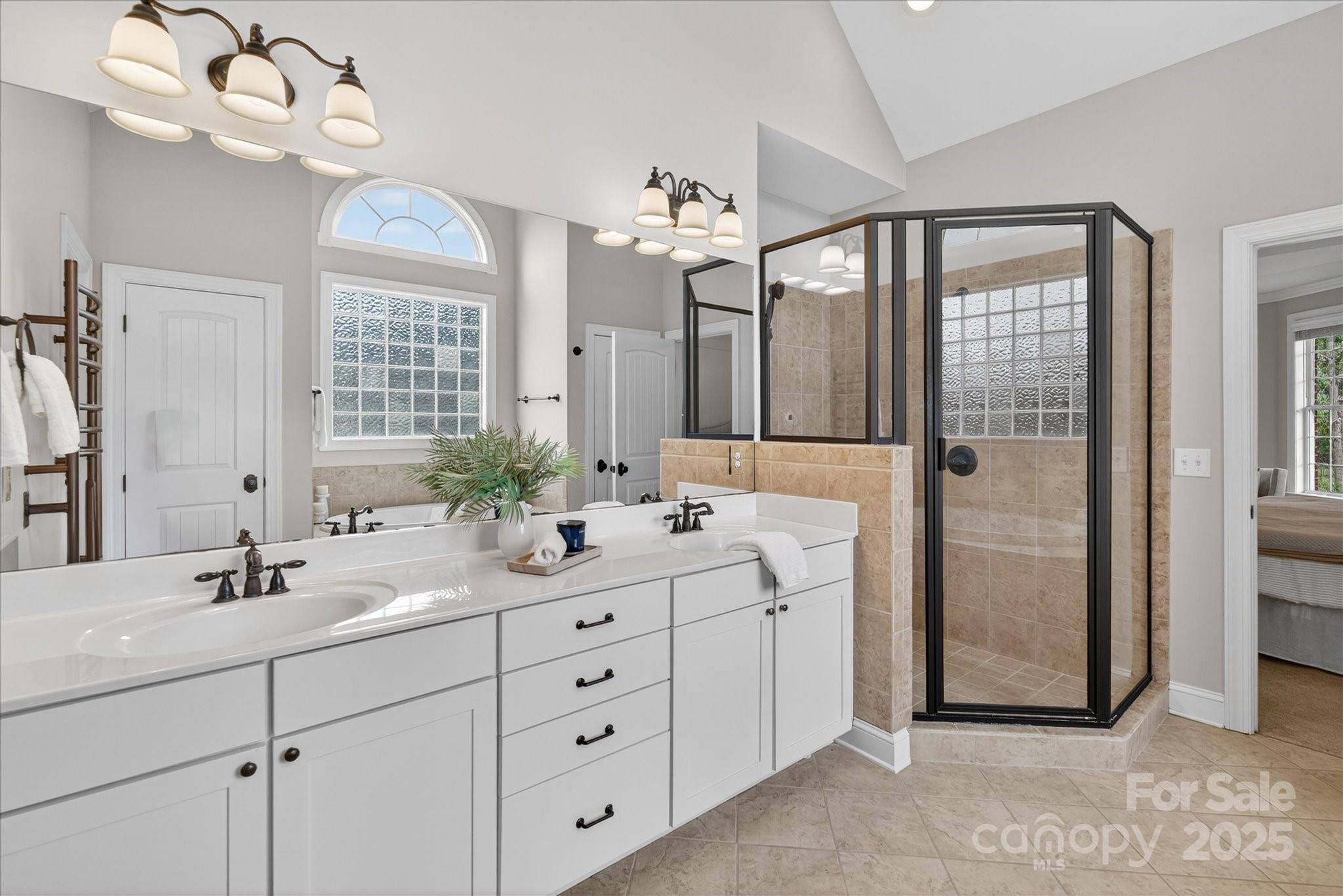 1912 Windmere Drive Monroe, NC 28110 - Photo 21 of 37 a bathroom with a double vanity sink mirror and shower