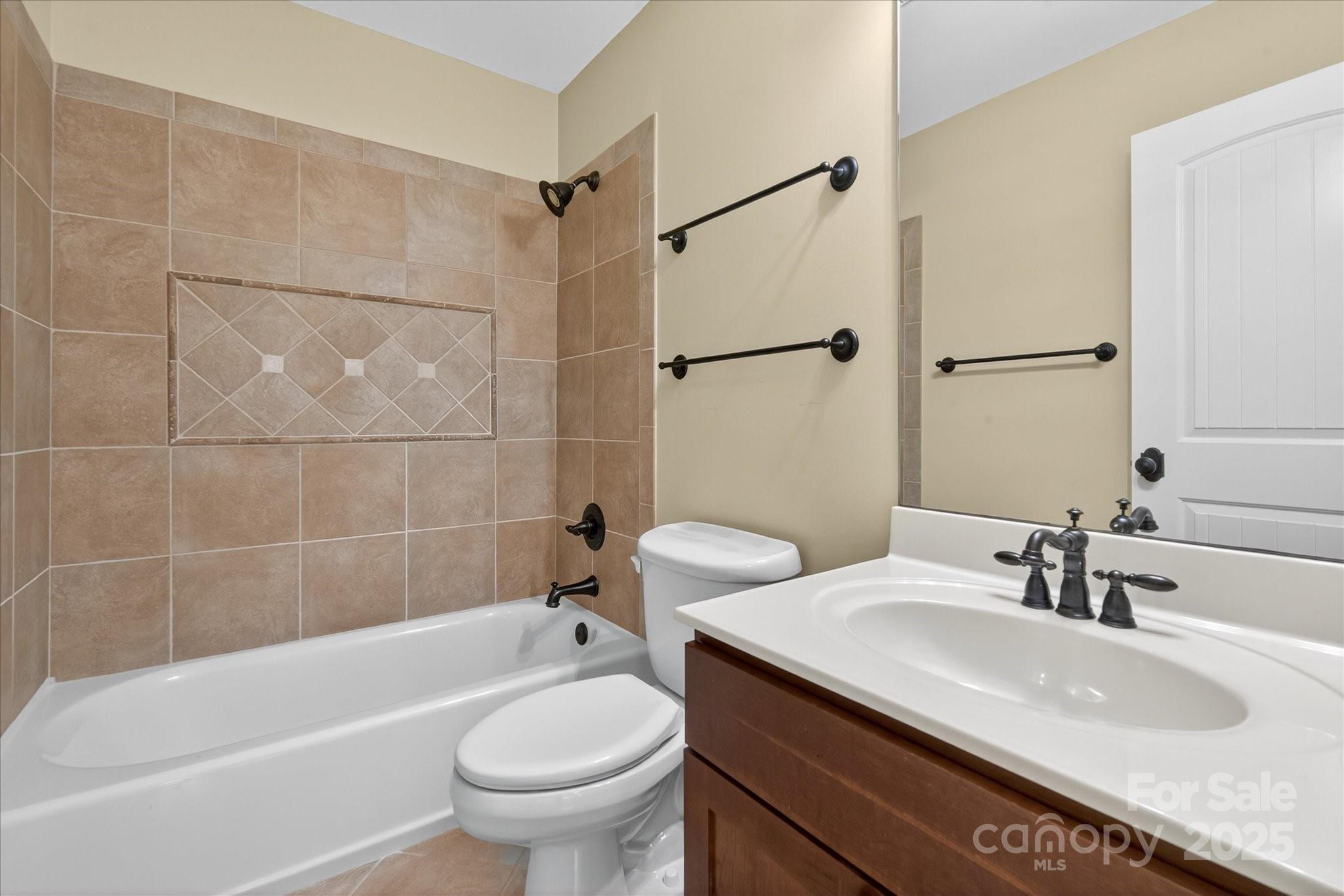 1912 Windmere Drive Monroe, NC 28110 - Photo 27 of 37 a bathroom with a granite countertop sink a toilet and shower
