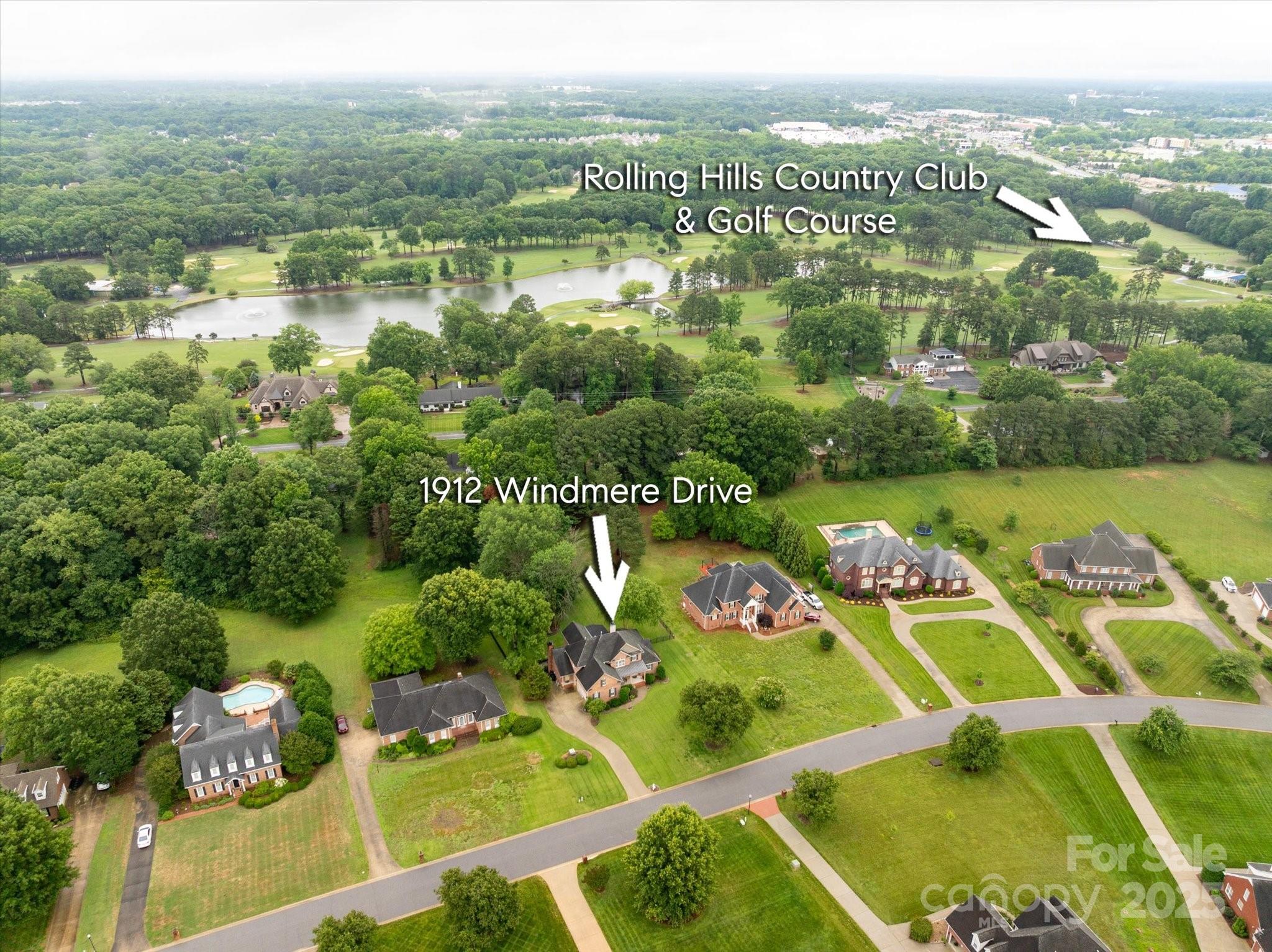 1912 Windmere Drive Monroe, NC 28110 - Photo 37 of 37 an aerial view of a house with a lake view