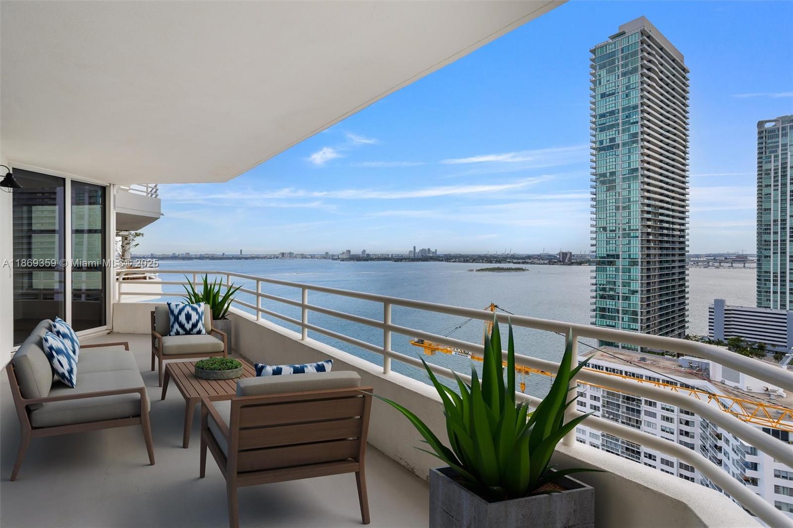 555 Northeast 34th Street, Unit 2007 Miami, FL 33137 - Photo 2 of 3 a balcony with furniture and a potted plant