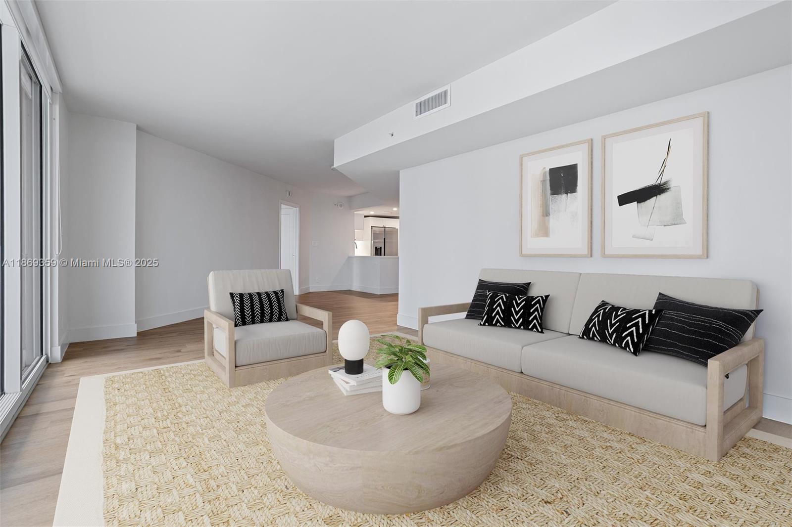 555 Northeast 34th Street, Unit 2007 Miami, FL 33137 - Photo 3 of 3 a living room with furniture and a rug