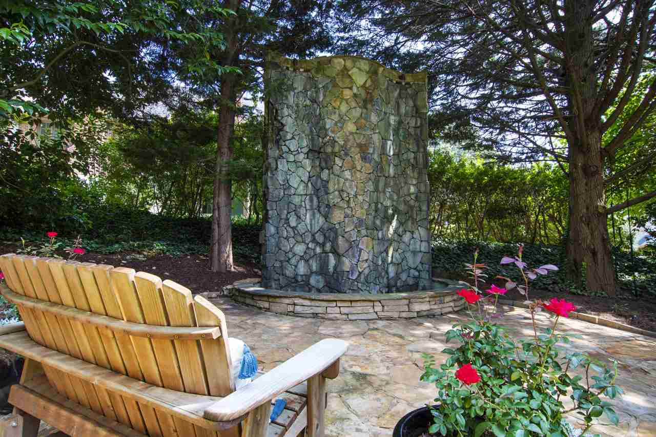 1806 10th Avenue Raleigh, NC 27607 - Photo 28 of 30 Soothing sounds come from this decorative waterfall...a perfect backdrop for summer evenings. Don't miss the firepit nook off to the side yard and the trellised walkway along the other. Outdoor living is gracious at 1806 Ridge Rd. Decorative Fountain