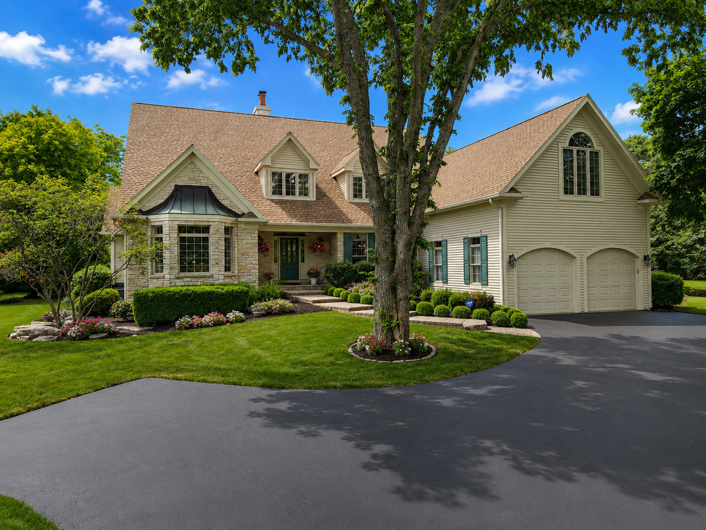 209 Carriage Trail Barrington, IL 60010 - Photo 1 of 42 a front view of a house with a yard and garage