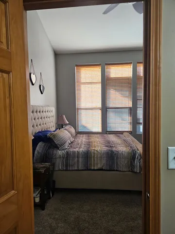 a bedroom with a bed and window
