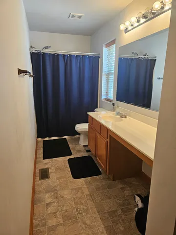 a bathroom with a sink and a vanity
