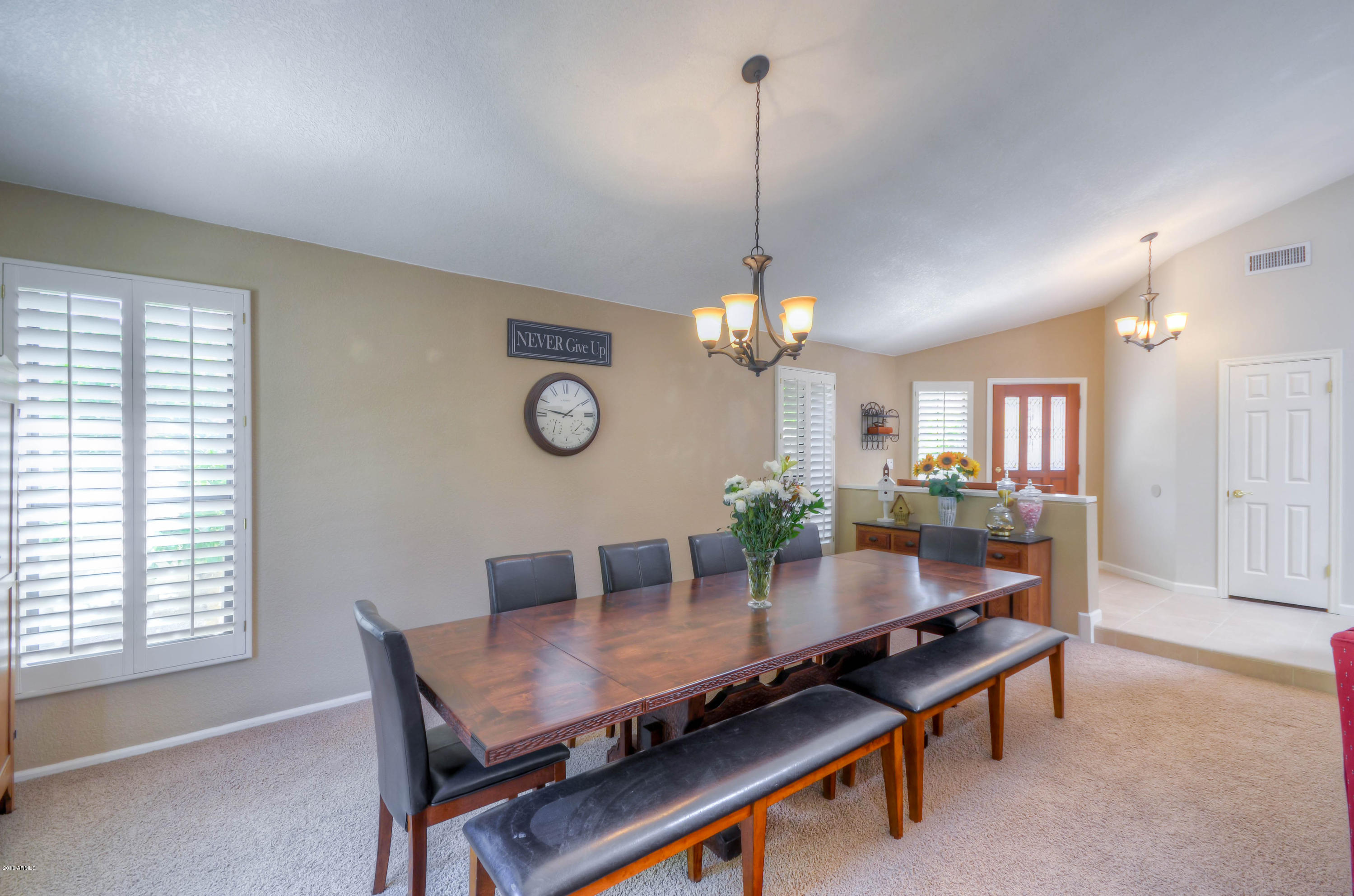 1433 North Woodside Road Chandler, AZ 85224 - Photo 11 of 70 a view of a dining room with furniture window and wooden floor