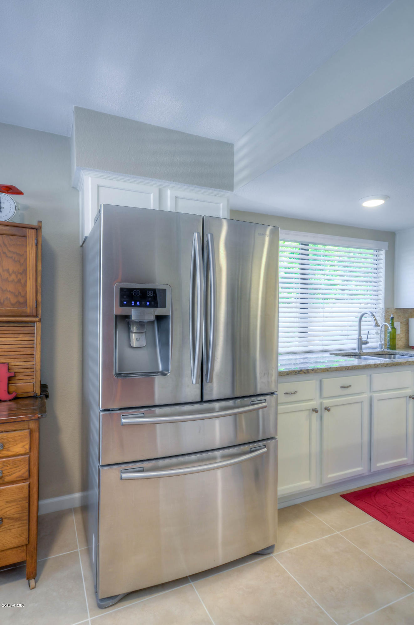 1433 North Woodside Road Chandler, AZ 85224 - Photo 19 of 70 a kitchen with stainless steel appliances granite countertop a refrigerator and a sink