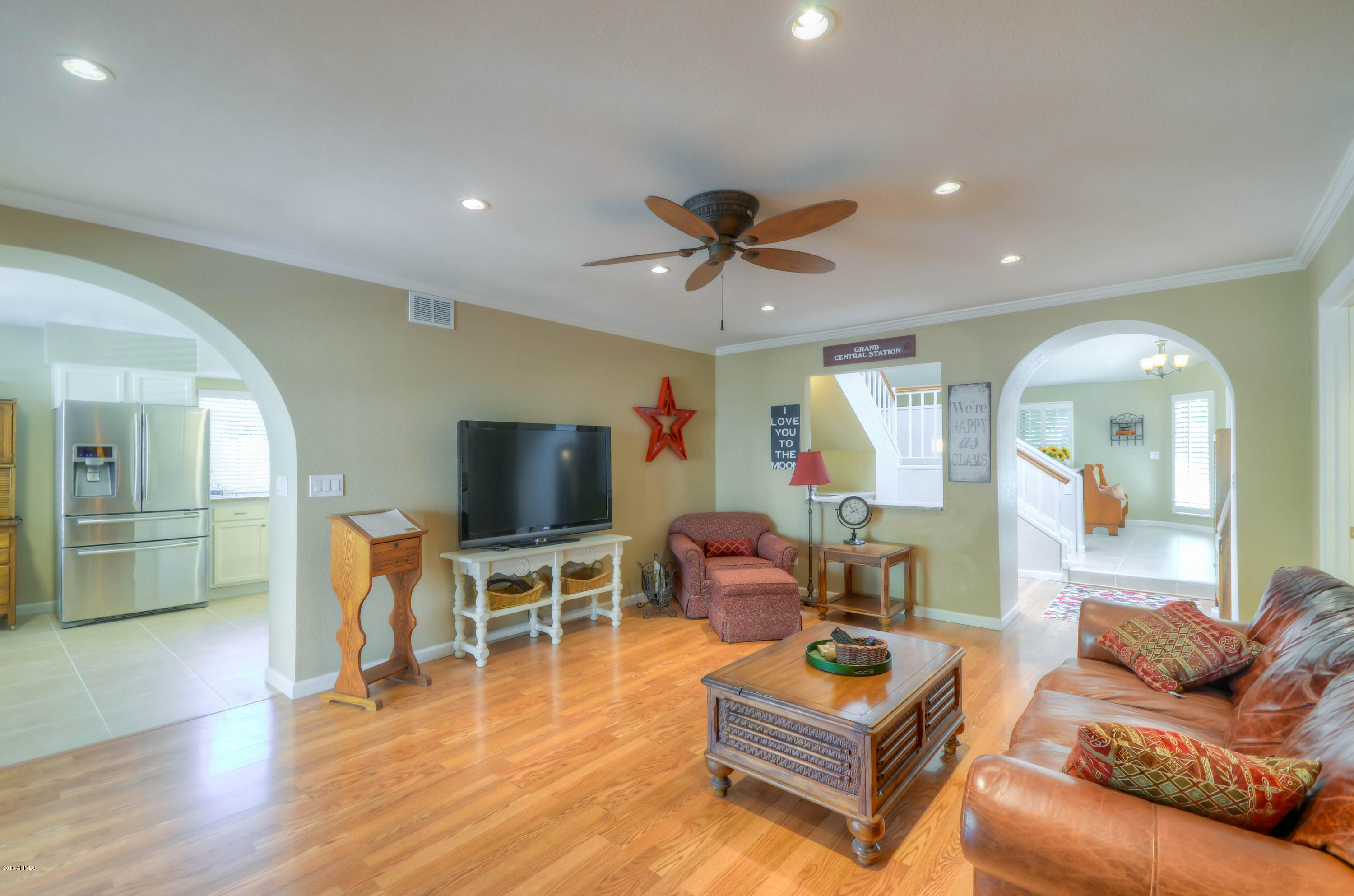1433 North Woodside Road Chandler, AZ 85224 - Photo 26 of 70 a living room with furniture and a flat screen tv