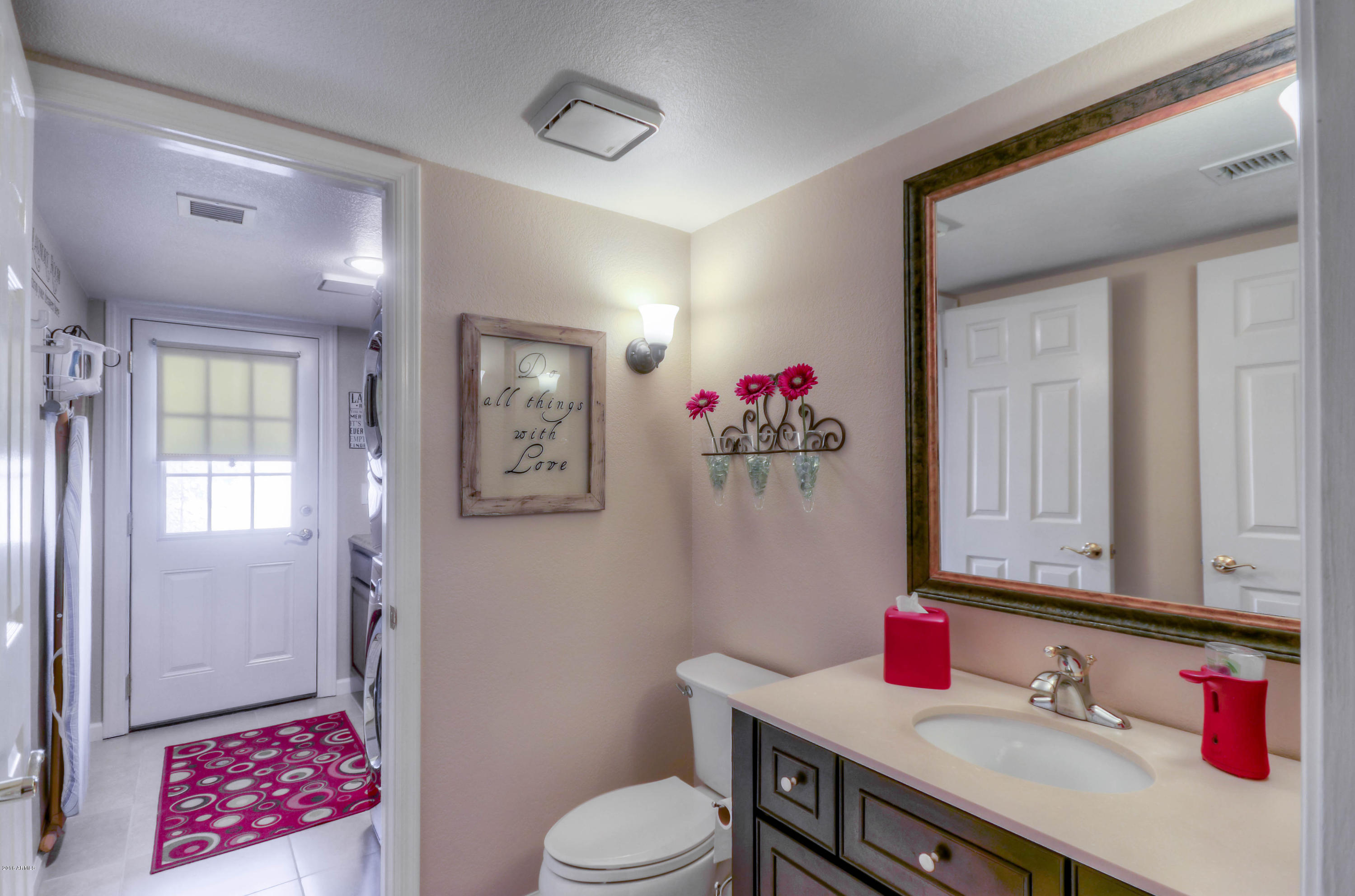 1433 North Woodside Road Chandler, AZ 85224 - Photo 31 of 70 a bathroom with a sink vanity mirror and toilet
