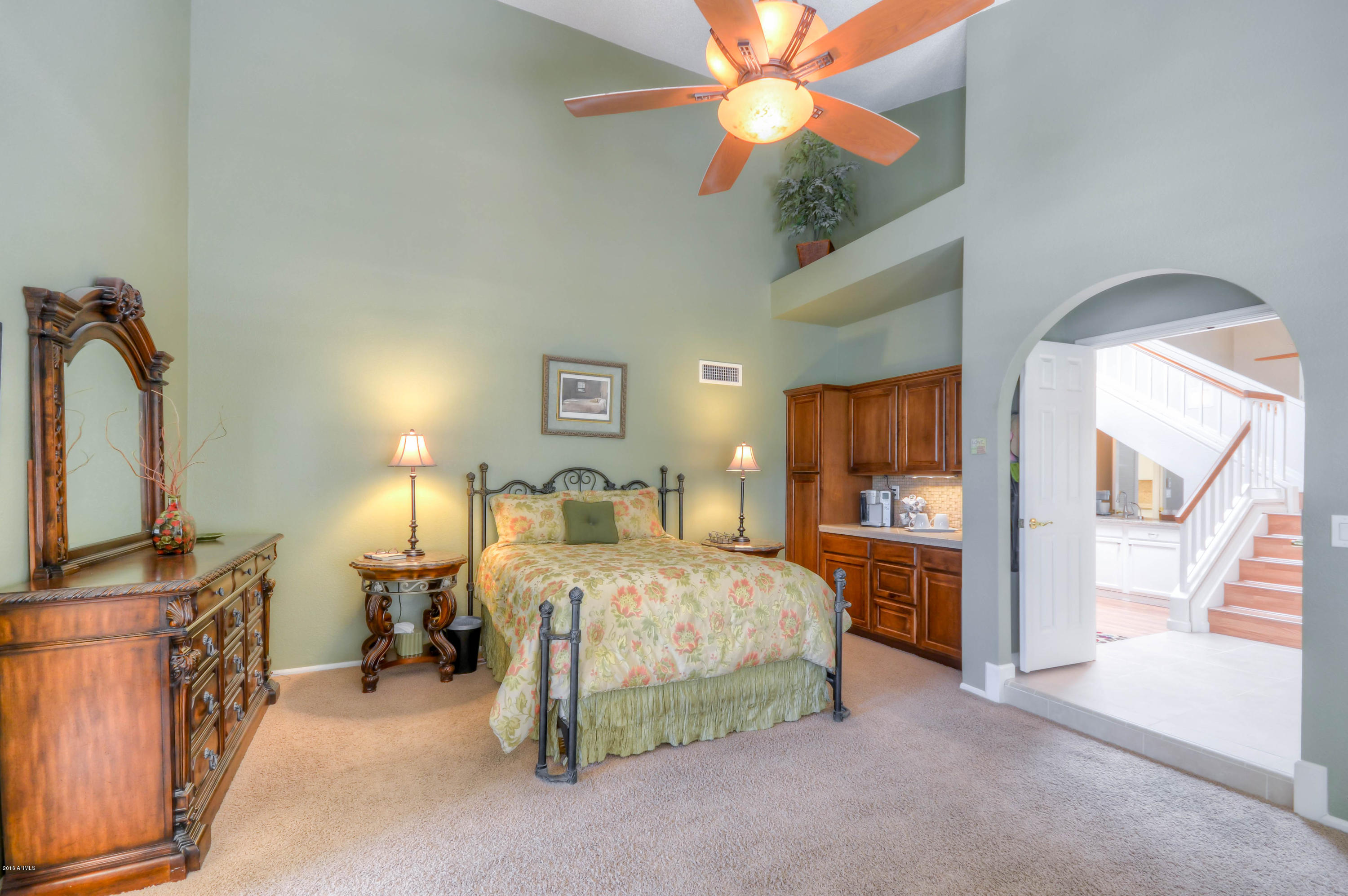 1433 North Woodside Road Chandler, AZ 85224 - Photo 33 of 70 a bedroom with a bed and a flat tv screen on dresser
